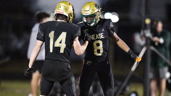 Nease Panthers Emmanuel Williams (8) celebrates with teammate Maddox Spencer (14) after Williams pulled in an open field pass that he ran in for a touchdown early in the fourth quarter. The Niceville Eagles traveled to Nease High School in St. Johns County for the FHSAA Region 1-4S high school football playoff game Friday, November 10, 2023. The Eagles led 35 to 7 at the half and came away with a 55 to 21 victory over the Panthers.