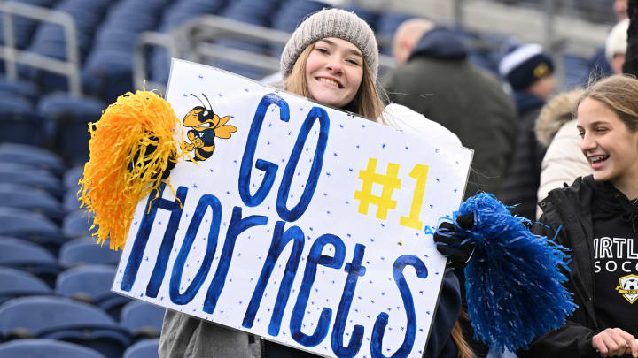 A Kirtland fan holds a sign up during the 2022 OHSAA Division VI state championship game.