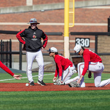 Louisville baseball coach Dan McDonnell looked on during team drills at Jim Patterson Stadium on Tuesday, Feb. 13, 2024.