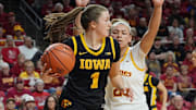 Iowa Hawkeyes guard Taylor Stremlow (1) looks for pass around Iowa Hawkeyes guard Taylor McCabe (2) during the first quarter in the NCAA women’s basketball Cy-Hawk Series on Dec. 10, 2025, at Hilton Coliseum in Ames, Iowa.