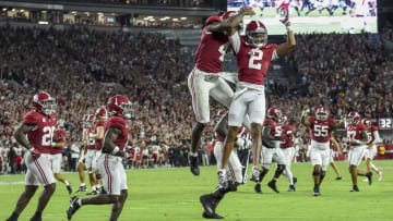 Aug 31, 2024; Tuscaloosa, Alabama, USA;  Alabama Crimson Tide quarterback Jalen Milroe (4) and wide receiver Ryan Williams (2) celebrate a touchdown by Williams against the Western Kentucky Hilltoppers at Bryant-Denny Stadium. Mandatory Credit: Gary Cosby Jr.-USA TODAY Sports