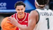 Wisconsin Badgers guard John Tonje (9) smiles while guarding Michigan State Spartans guard Jeremy Fears Jr. (1) on Saturday, March 15, 2025, in a semifinals game at the 2025 TIAA Big Ten Men’s Basketball Tournament between the Michigan State Spartans and the Wisconsin Badgers at Gainbridge Fieldhouse in Indianapolis. The Wisconsin Badgers defeated the Michigan State Spartans, 77-74.