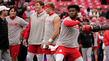 Ohio State Buckeyes quarterback Air Noland (12) warms up prior to the NCAA football game against the Indiana Hoosiers at Ohio Stadium in Columbus on Saturday, Nov. 23, 2024.