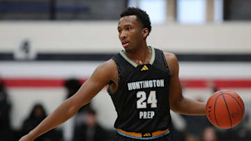 Huntington Prep guard Darryn Peterson takes the ball up the court during the first half at Canton Memorial Field House, Saturday, Feb. 17, 2024.