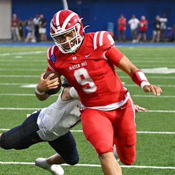 Mater Dei QB Ashton Beierly rushes for a gain against Bishop Gorman on September 6, 2023. 