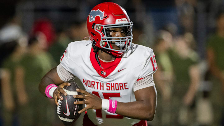 North Shore quarterback Kaleb Bailey rolls out of the pocket. North Shore quarterback Kaleb Bailey rolls out of the pocket.