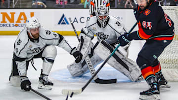 Coachella Valley forward Devin Shore (94) passes the puck away from Ontario defenseman Kevin Connauton (44) to try to set up a teammate with a shot as goaltender Erik Portillo (1) looks on during the first period of Game 2 of the Pacific Division Finals at Acrisure Arena in Palm Desert, Calif., Friday, May 17, 2024.