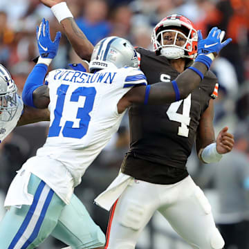 Dallas Cowboys defensive end Marshawn Kneeland (94) and linebacker DeMarvion Overshown (13)