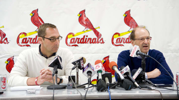 Feb 16, 2011; Jupiter, FL, USA; St. Louis Cardinals general manager John Mozeliak and chairman Bill DeWitt Jr. address the media after the Albert Pujols contract extension deadline expired during spring training at Roger Dean Stadium. Mandatory Credit: Scott Rovak-Imagn Images