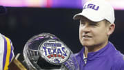 Dec 29, 2015; Houston, TX, USA; LSU Tigers head coach Les Miles holds the Texas Bowl trophy after defeating the Texas Tech Red Raiders 56-27 at NRG Stadium. 