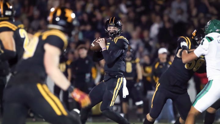 Newbury Park quarterback Brady Smigiel spots a receiver downfield before the Thousand Oaks defense can reach him during the first quarter of the teams' CIF-SS Division 5 semifinal game on Friday, Nov. 17, 2023, at Newbury Park High. Newbury Park won 22-19.