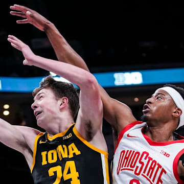 Iowa's Pryce Sandfort goes up for a basket Wednesday against Ohio State's Micah Parrish.