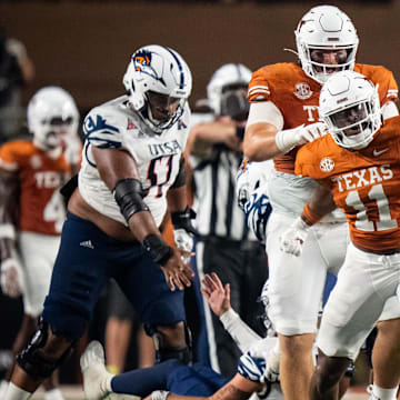 Sep 14, 2024; Austin, Texas, USA; Texas Longhorns linebacker Colin Simmons (11) celebrates a sack in the third quarter against the UTSA Roadrunners at Darrell K Royal–Texas Memorial Stadium. Mandatory Credit: Sara Diggins/USA TODAY Network via Imagn Images