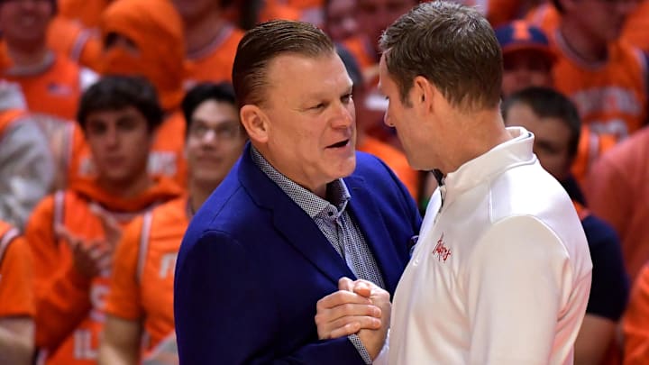 Jan 31, 2023; Champaign, Illinois, USA; Illinois Fighting Illini head coach Brad Underwood (left) and Nebraska Cornhuskers head coach Fred Hoiberg (right) shake hands before the game at State Farm Center. Mandatory Credit: Ron Johnson-Imagn Images