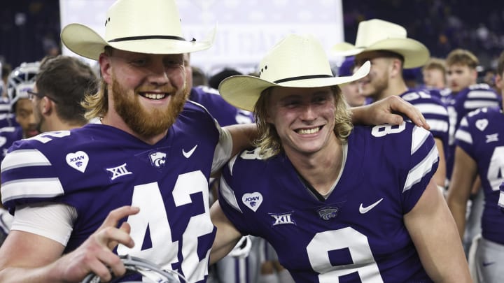 Jan 4, 2022; Houston, TX, USA; Kansas State Wildcats long snapper Randen Plattner (42) and Kansas State Wildcats punter Ty Zentner (8) celebrate winning the Texas Bowl after defeating the LSU Tigers in the 2022 Texas Bowl at NRG Stadium. Mandatory Credit: Thomas Shea-USA TODAY Sports