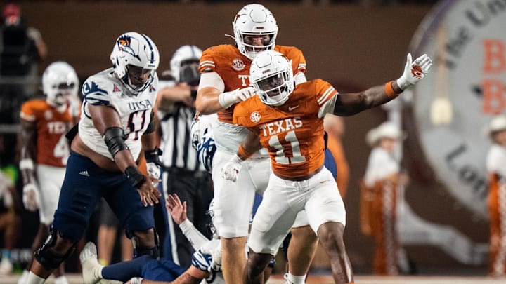 Sep 14, 2024; Austin, Texas, USA; Texas Longhorns linebacker Colin Simmons (11) celebrates a sack in the third quarter against the UTSA Roadrunners at Darrell K Royal–Texas Memorial Stadium. Mandatory Credit: Sara Diggins/USA TODAY Network via Imagn Images