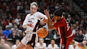 Mar 29, 2024; Portland, OR, USA; Stanford Cardinal forward Brooke Demetre (21) battle for control of the ball against NC State Wolfpack guard Zoe Brooks (35) during the second half in the semifinals of the Portland Regional of the 2024 NCAA Tournament at the Moda Center at the Moda Center. Mandatory Credit: Troy Wayrynen-Imagn Images