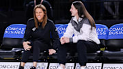 Indiana Fever guard Caitlin Clark talks with head coach Stephanie White before the game against the Washington Mystics. 