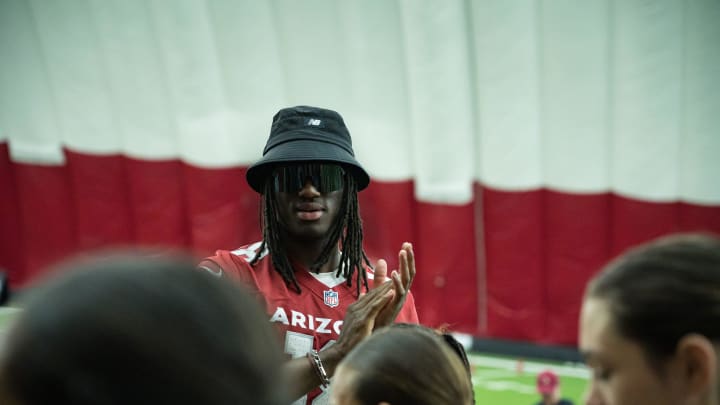 Marvin Harrison Jr. claps for the student athletes during the Cardinals girls flag football clinic at the Cardinals training facility on June 1, 2024 in Tempe, Ariz.