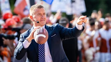 Analysts Kirk Herbstreit tosses the football with fans on the set of ESPN's College Game Day at the University of Texas, ahead of the Longhorns' game against the Georgia Bulldogs in Austin, Oct. 19, 2024.