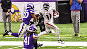 Atlanta Falcons wide receiver Julio Jones stiff arms Minnesota Vikings linebacker Eric Wilson on his way to a 40-yard touchdown reception in the third quarter at U.S. Bank Stadium. 
