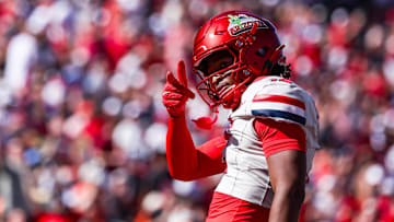 Oct 4, 2025; Tucson, Arizona, USA; Arizona Wildcats wide receiver Tre Spivey (12) celebrates after a play during the third quarter of the game against the Oklahoma State Cowboys at Arizona Stadium. Mandatory Credit: Aryanna Frank-Imagn Images