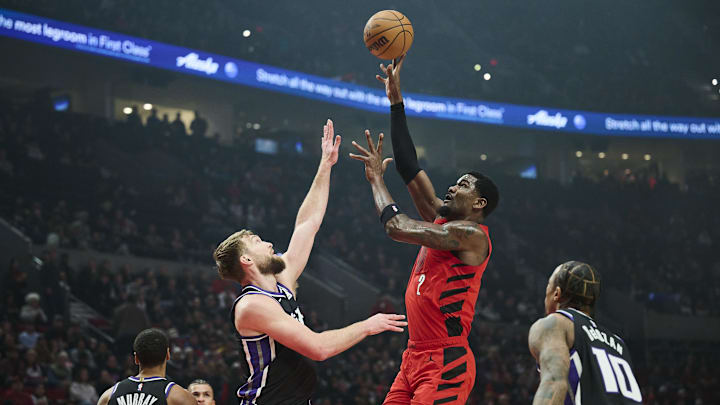 Portland Trail Blazers center Deandre Ayton shoots a jump shot the ball during the first half against Sacramento Kings forward Domantas Sabonis at Moda Center. Portland Trail Blazers center Deandre Ayton shoots a jump shot the ball during the first half against Sacramento Kings forward Domantas Sabonis at Moda Center.