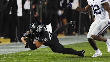 Iowa State Cyclones tight end DeShawn Hanika (83) catches the ball around Kansas State Wildcats linebacker Desmond Purnell (32) during the first quarter at Jack Trice Stadium Saturday, Oct. 8, 2022, in Ames, Iowa.