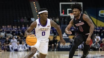 Xavier Brown (0) drives to the hoop during the Arkansas State vs James Madison game.