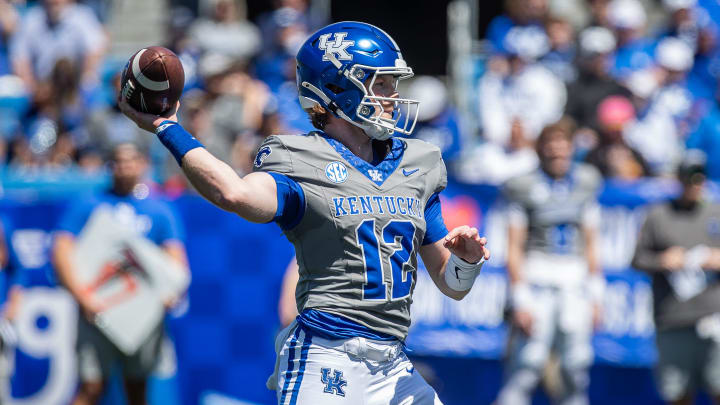 Kentucky quarterback Brock Vandagriff (12) dropped back for a pass during the Kentucky Wildcats' Blue White scrimmage at Kroger Field on Saturday afternoon in Lexington, Kentucky. April 13, 2024