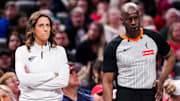 Indiana Fever head coach Stephanie White stands next to an official during the game