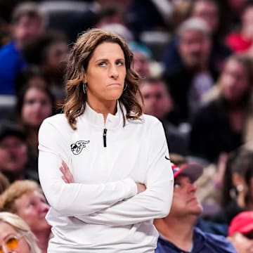 Indiana Fever head coach Stephanie White stands next to an official during the game