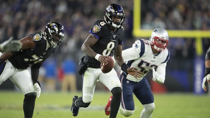 Nov 3, 2019; Baltimore, MD, USA; Baltimore Ravens quarterback Lamar Jackson (8) runs past New England Patriots linebacker Kyle Van Noy (53) during the fourth quarter at M&T Bank Stadium. Mandatory Credit: Tommy Gilligan-Imagn Images