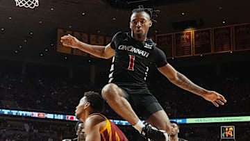 Iowa State Cyclones forward Joshua Jefferson (2) looks for a shot as Cincinnati Bearcats' guard Day Day Thomas (1) attempts to defend during the second half in the Big-12 men’s basketball at Hilton Coliseum on Feb. 15, 2025 in Ames, Iowa.