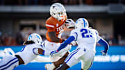 Texas Longhorns wide receiver Matthew Golden (2) navigates through Kentucky defense, including Kentucky Wildcats defensive back Jordan Lovett (25) in the first quarter of the Texas Longhorns' game against the Kentucky Wildcats at Darrell K Royal Texas Memorial Stadium in Austin, Nov. 23, 2024.