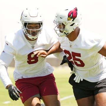 Arizona Cardinals linebackers BJ Ojulari (9) and Zaven Collins (25) during organized team activities at the Dignity Health Arizona Cardinals Training Center in Tempe on June 3, 2024.
