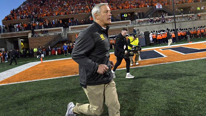 Oct 8, 2022; Champaign, Illinois, USA;  Iowa Hawkeyes head coach Kirk Ferentz runs out on the field before the kickoff against the Illinois Fighting Illini at Memorial Stadium. Mandatory Credit: Ron Johnson-USA TODAY Sports
