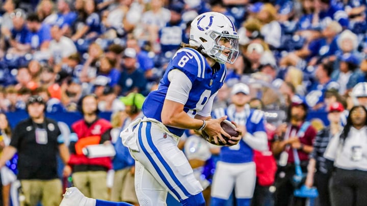 Indianapolis Colts QB Jason Bean (8) scrambles with the ball during a pre-season game between the Indianapolis Colts and the Denver Broncos on Sunday, August. 11, 2024 at Lucas Oil Stadium in Indianapolis.