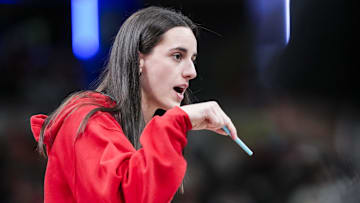 Jun 3, 2025; Indianapolis, Indiana, USA;  Indiana Fever guard Caitlin Clark (22) talks with an official during a timeout at a game between the Indiana Fever and the Washington Mystics at Gainbridge Fieldhouse in Indianapolis. Mandatory Credit:  Grace Smth- INDIANAPOLIS STAR-Imagn Images