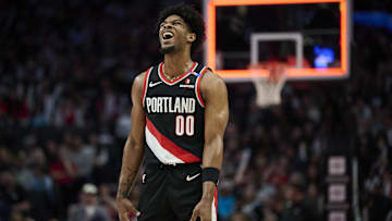 Feb 22, 2025; Portland, Oregon, USA; Portland Trail Blazers guard Scoot Henderson (00) reacts after missing a three point basket during the second half against the Charlotte Hornets at Moda Center. Mandatory Credit: Troy Wayrynen-Imagn Images