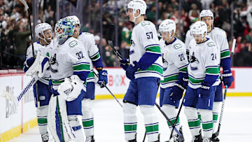 Dec 3, 2024; Saint Paul, Minnesota, USA; Vancouver Canucks players react after their teams overtime loss against the Minnesota Wild at Xcel Energy Center. Mandatory Credit: Matt Krohn-Imagn Images