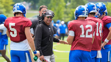 Kentucky Wildcats offensive coordinator and quarterback coach Bush Hamdan coaches the quarterbacks during practice on Friday, August 1, 2025