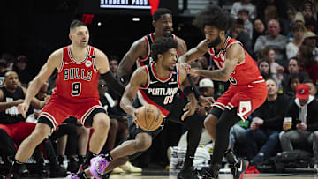 Jan 19, 2025; Portland, Oregon, USA; Portland Trail Blazers guard Scoot Henderson (00) drives to the basket during the first half against Chicago Bulls guard Coby White (0) at Moda Center. Mandatory Credit: Troy Wayrynen-Imagn Images