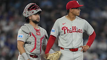 Jun 5, 2025; Toronto, Ontario, CAN; Philadelphia Phillies catcher Rafael Marchan (13) and starting pitcher Jesus Luzardo (44) look towards the bullpen after giving up four runs in the third inning against the Toronto Blue Jays at Rogers Centre. 