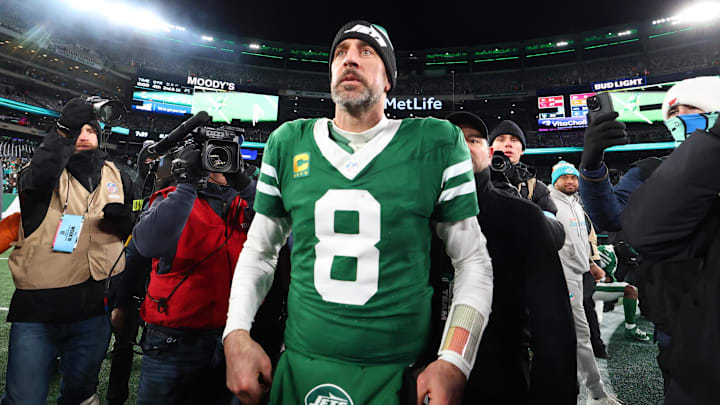 Jan 5, 2025; East Rutherford, New Jersey, USA; New York Jets quarterback Aaron Rodgers (8) walks on the field after the Jets win over the Miami Dolphins at MetLife Stadium. Jan 5, 2025; East Rutherford, New Jersey, USA; New York Jets quarterback Aaron Rodgers (8) walks on the field after the Jets win over the Miami Dolphins at MetLife Stadium.