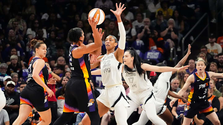 Las Vegas Aces center A'ja Wilson (22) pressures Phoenix Mercury forward Alyssa Thomas (25) in Game Four of the WNBA Finals at Mortgage Matchup Center on Oct. 10, 2025, in Phoenix. Las Vegas Aces center A'ja Wilson (22) pressures Phoenix Mercury forward Alyssa Thomas (25) in Game Four of the WNBA Finals at Mortgage Matchup Center on Oct. 10, 2025, in Phoenix.