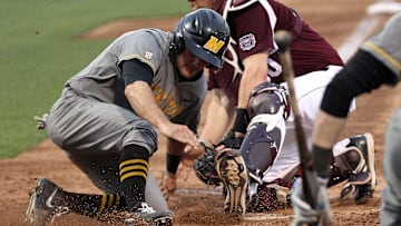 Mizzou's Dillion Everett slides past Missouri State catcher Luke Voit on Tuesday night at Hammons Field.

Baseball Missouri 5 Missouri State 4