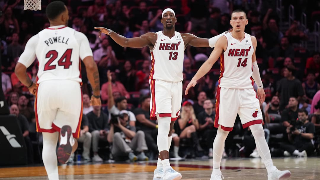 Dec 1, 2025; Miami, Florida, USA; Miami Heat center Bam Adebayo (13), guard Norman Powell (24) and guard Tyler Herro (14) get back on defense against the Los Angeles Clippers during the second half at Kaseya Center. Mandatory Credit: Jim Rassol-Imagn Images
