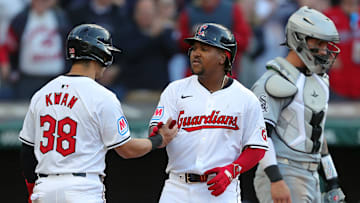 Cleveland Guardians' Jose Ramirez (11) celebrates with teammate Steven Kwan (38) at home after his two-run home run during the Guardians' home opener against the Chicago White Sox on April 8, 2024, in Cleveland, Ohio.