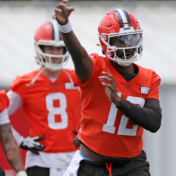 Browns quarterback Shedeur Sanders throws as QBs Dillon Gabriel (5) and Kenny Pickett look on during minicamp, Tuesday, June 10, 2025, in Berea.